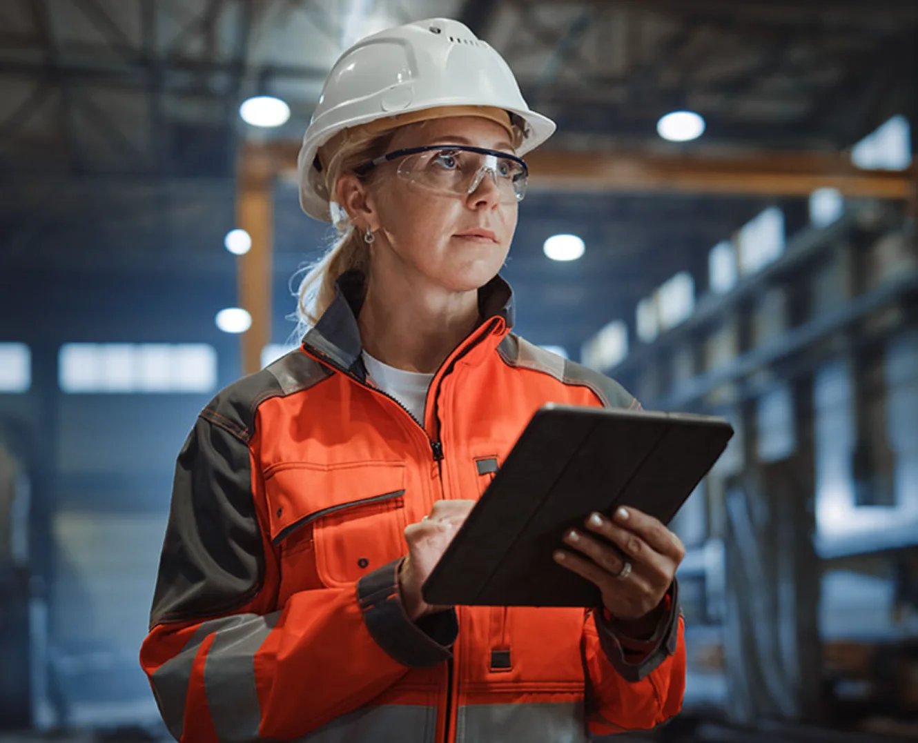 Contractor inspecting equipment and documenting notes at a worksite in Marietta GA