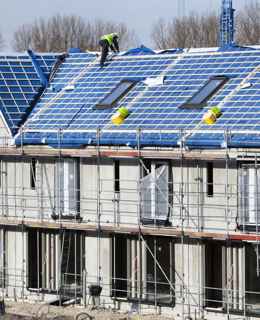 Roofing team installing new panels on a home renovation project in North Georgia